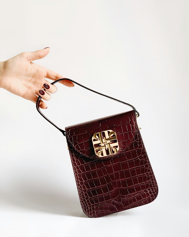 Vinted-style listing photo of a brown suede shoulder bag photographed on a plain background